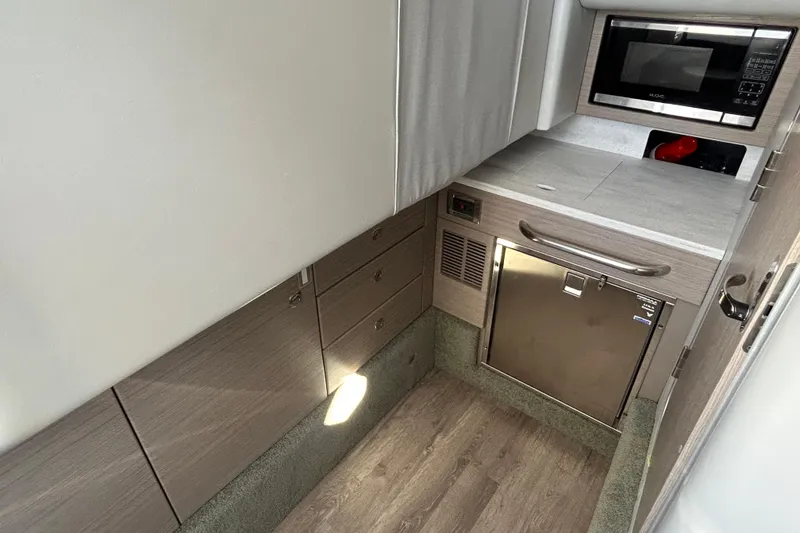 Slide: The Image of Interior of 2021 Formula 350 Crossover Bowrider I/O, featuring cozy seating and modern design. - 20