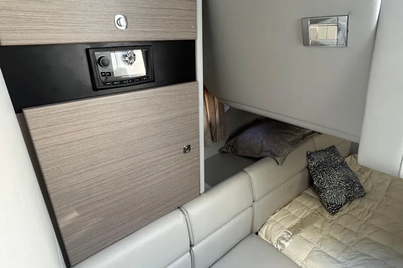 Slide: The Image of 2021 Formula 350 Crossover Bowrider I/O interior storage compartment with accessories. - 21