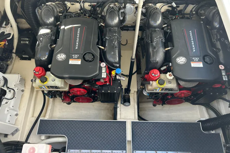 Slide: The Image of Engine compartment of 2021 Formula 350 Crossover Bowrider I/O with batteries and fire extinguisher. - 30