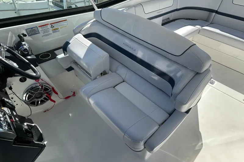 Slide: The Image of 2021 Formula 350 Crossover Bowrider I/O interior with luxurious seating and modern controls. - 5