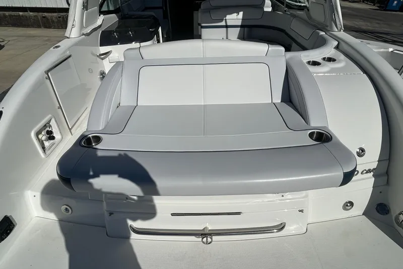 Slide: The Image of 2021 Formula 350 Crossover Bowrider I/O interior with sleek seating and cup holders. - 6