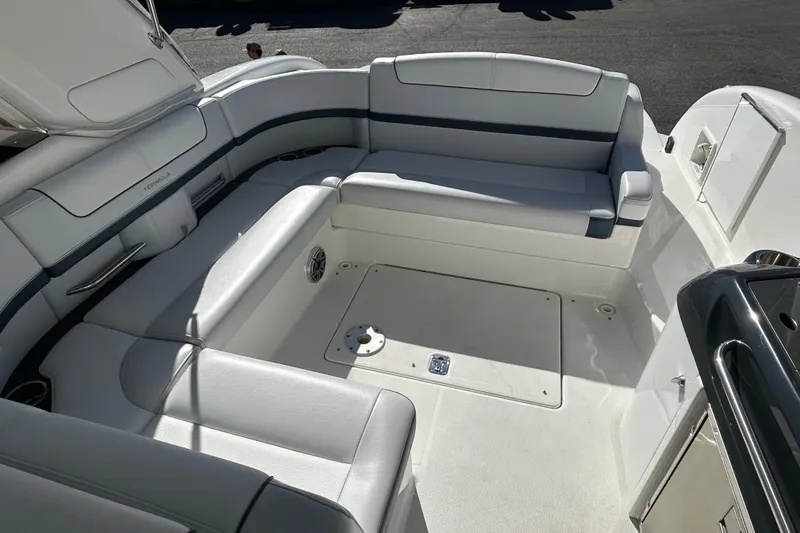 Slide: The Image of 2021 Formula 350 Crossover Bowrider I/O interior with spacious seating and sleek design. - 7