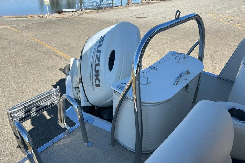 Slide: The Image of 2020 Tahoe Pontoon Cascade Platinum Quad Lounger with Suzuki outboard motor at dockside. - 14