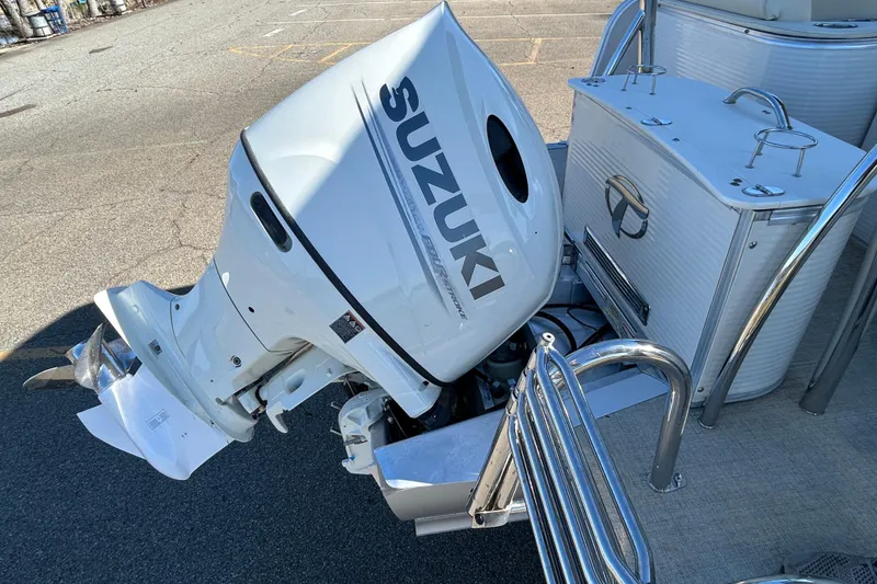 Slide: The Image of 2020 Tahoe Pontoon Cascade Platinum with Suzuki outboard motor in a parking lot. - 15