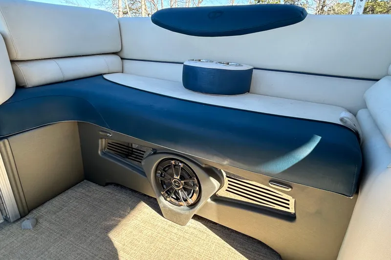 Slide: The Image of 2020 Tahoe Pontoon Cascade Platinum Quad Lounger interior with speaker and cup holders. - 16