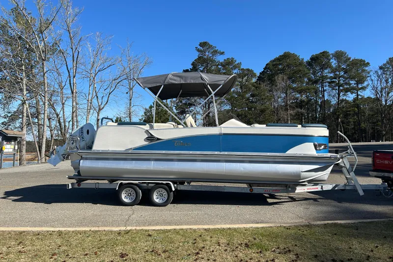 Slide: The Image of 2020 Tahoe Pontoon Cascade Platinum Quad Lounger 23' on trailer, parked outdoors. - 3