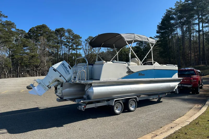 Slide: The Image of 2020 Tahoe Pontoon Cascade Platinum Quad Lounger 23' on trailer in parking lot. - 4