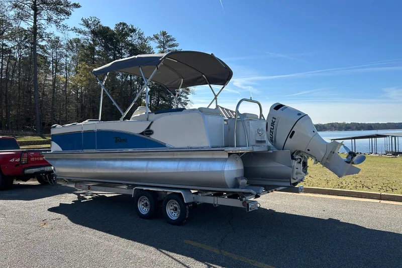 Slide: The Image of 2020 Tahoe Pontoon Cascade Platinum Quad Lounger 23' on trailer by lakeside. - 6
