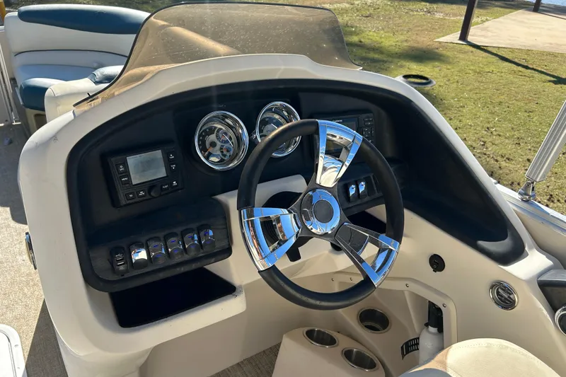 Slide: The Image of Steering console of 2020 Tahoe Pontoon Cascade Platinum Quad Lounger 23' boat. - 8