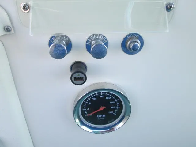 Slide: The Image of Dashboard of 1976 Tollycraft 26 Sedan with switches and GPH gauge. - 12