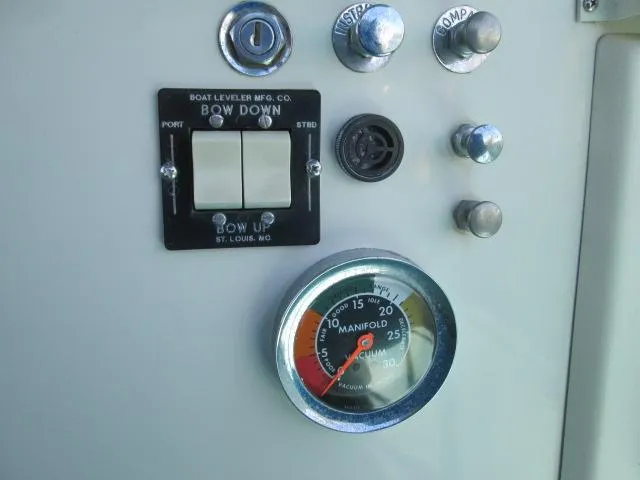 Slide: The Image of Dashboard of a 1976 Tollycraft 26 Sedan with manifold gauge. - 13