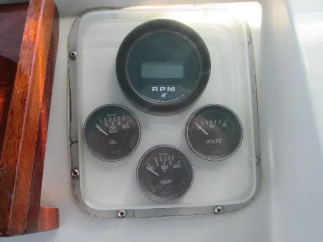 Slide: The Image of Dashboard of a 1976 Tollycraft 26 Sedan with RPM and gauges. - 14