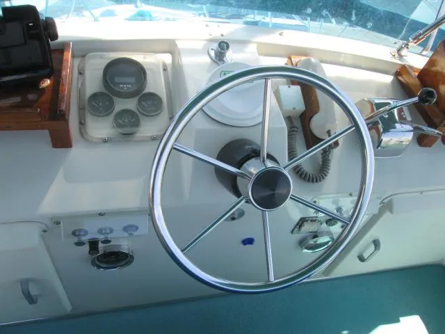 Slide: The Image of Helm of a 1976 Tollycraft 26 Sedan boat. - 16