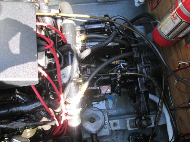 Slide: The Image of Engine compartment of 1976 Tollycraft 26 Sedan with cables and fire extinguisher. - 23