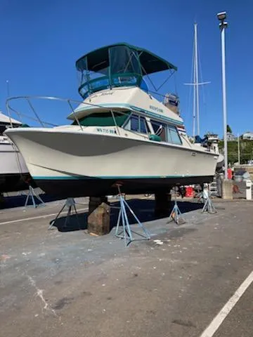 Slide: The Image of 1976 Tollycraft 26 Sedan boat docked at harbor. - 3