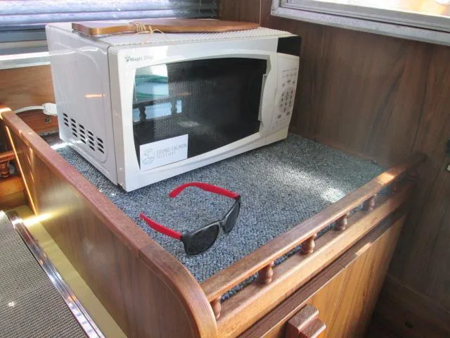 Slide: The Image of Microwave and sunglasses on Tollycraft 26 Sedan, 1976 model. - 32