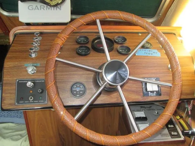 Slide: The Image of 1976 Tollycraft 26 Sedan helm with wooden dashboard and instruments. - 37