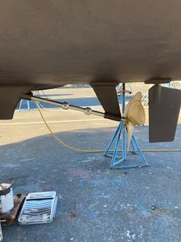 Slide: The Image of Underside of a 1976 Tollycraft 26 Sedan with propeller and rudder. - 8