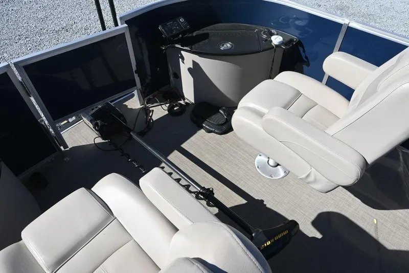 Slide: The Image of Interior of a 2018 Ranger 223F boat with beige seating and control panel. - 10
