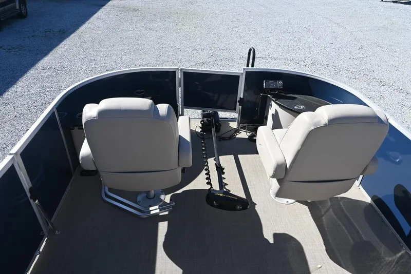 Slide: The Image of 2018 Ranger 223F boat interior with two seats and control panel. - 8