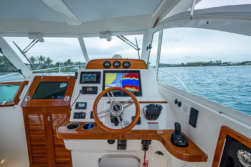 Slide: The Image of Helm of 2019 Hunt Yachts Surfhunter 32 with navigation equipment and ocean view. - 25
