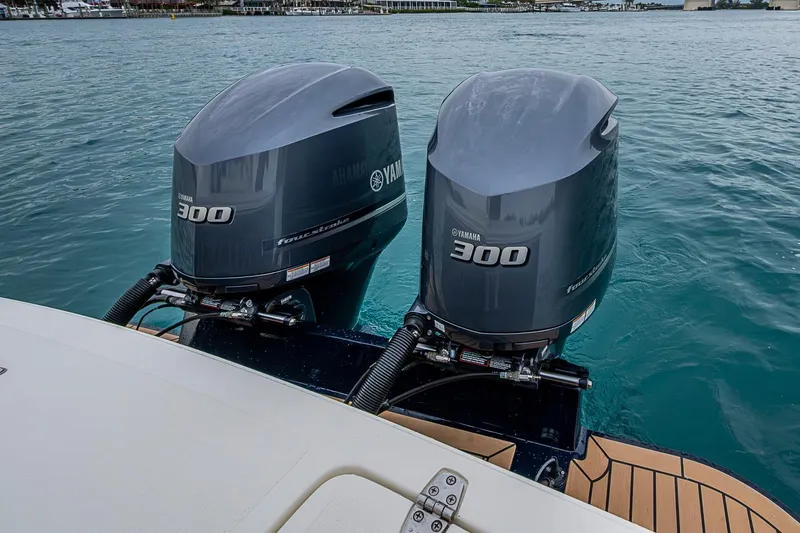 Slide: The Image of Twin Yamaha 300 outboard engines on a 2019 Hunt Yachts Surfhunter 32 in water. - 31