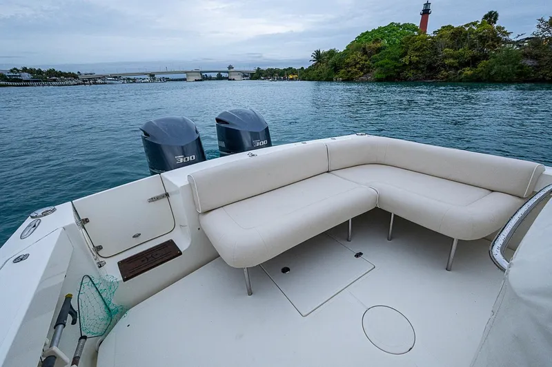 Slide: The Image of 2019 Hunt Yachts Surfhunter 32 with twin engines, spacious seating, and scenic water view. - 32