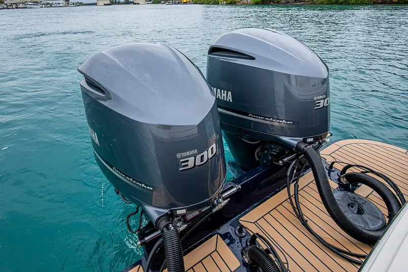 Slide: The Image of Twin Yamaha 300 outboard engines on a 2019 Hunt Yachts Surfhunter 32 in water. - 36