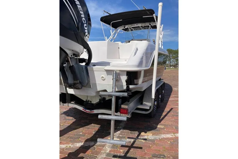 Slide: The Image of 2005 Donzi 35 ZF Daytona boat rear view with Mercury engine and ladder. - 10