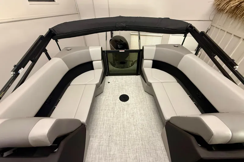 Slide: The Image of 2026 Alera A 22 Q boat interior with gray seating and black canopy. - 10