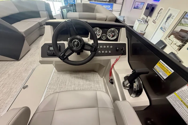 Slide: The Image of 2026 Alera A 22 Q boat interior with steering wheel and control panel. - 11