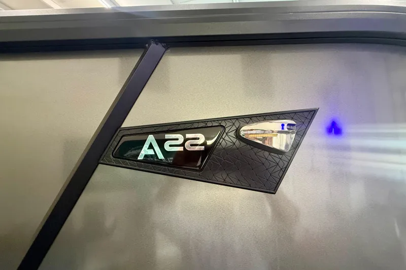 Slide: The Image of 2026 Alera A 22 Q vehicle emblem on sleek metallic surface. - 5