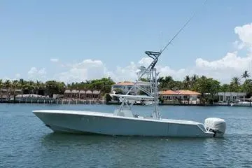 The Image of 2017 SeaVee 390Z boat on calm water with coastal homes in the background. - 0