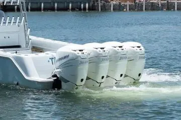 Slide: The Image of 2017 SeaVee 390Z boat with four powerful outboard engines on the water. - 13