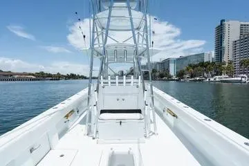 Slide: The Image of 2017 SeaVee 390Z boat on water with city skyline in background. - 6