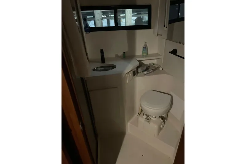 Slide: The Image of Bathroom interior of 1995 Carver 350 Aft Cabin Motor Yacht, featuring toilet and sink. - 11