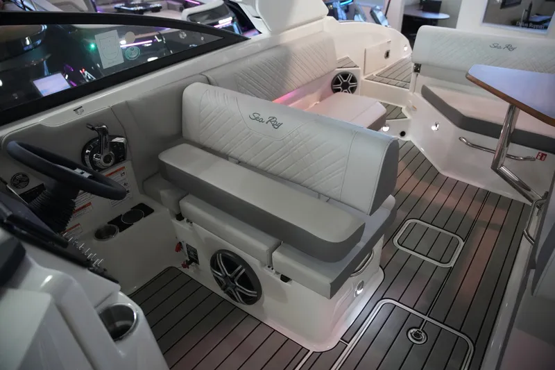 Slide: The Image of The image shows the interior of a 2026 Sea Ray SDX 270 boat with sleek seating. - 16