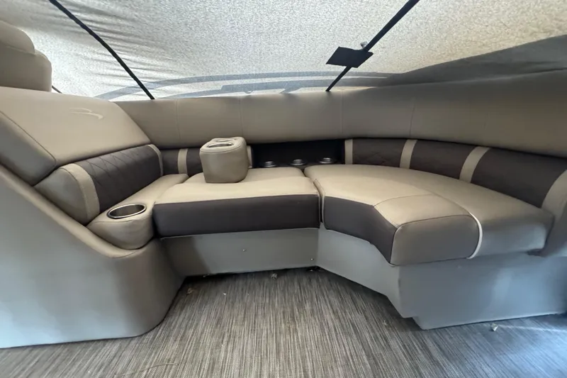Slide: The Image of Luxurious seating area in a 2020 Bennington 22SSRXP pontoon boat with cup holders. - 11