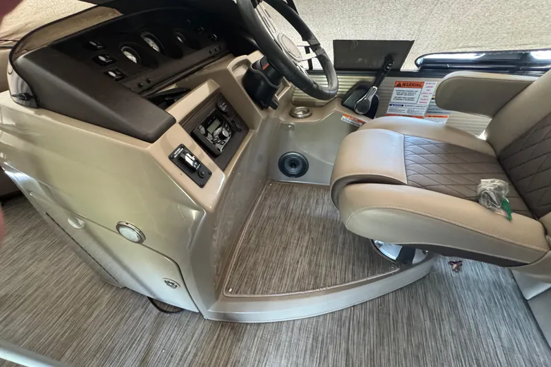 Slide: The Image of Interior of a 2020 Bennington 22SSRXP boat showing steering console and seating. - 17