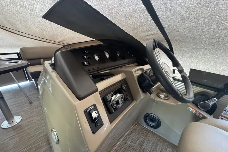 Slide: The Image of 2020 Bennington 22SSRXP boat interior with steering wheel and control panel. - 18