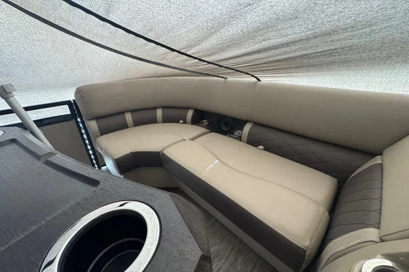 Slide: The Image of Interior of 2020 Bennington 22SSRXP pontoon boat with beige and brown seating. - 19