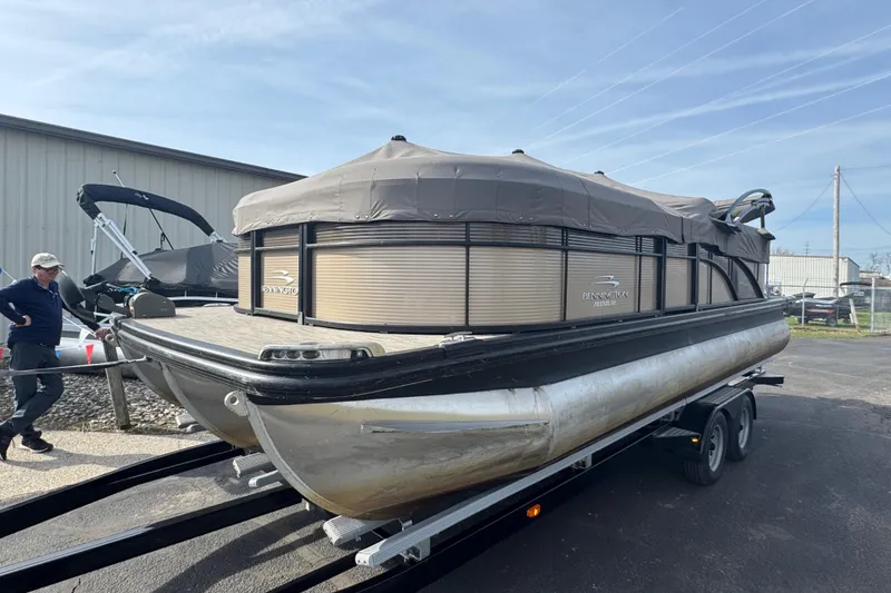 The Image of 2020 Bennington 22SSRXP pontoon boat on trailer, covered and parked outdoors. - 7