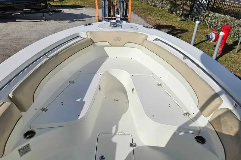 Slide: The Image of 2018 NauticStar 25 XS boat interior with spacious seating and storage compartments. - 4