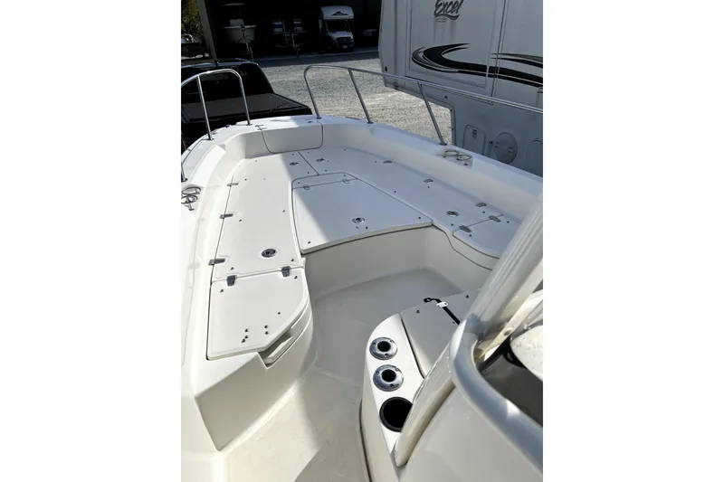 Slide: The Image of 2018 Boston Whaler 240 Dauntless boat interior with spacious seating and storage compartments. - 11