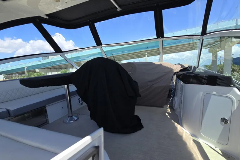 Slide: The Image of 2007 Cruisers Yachts 447 Sport Sedan interior with covered helm and seating area. - 13