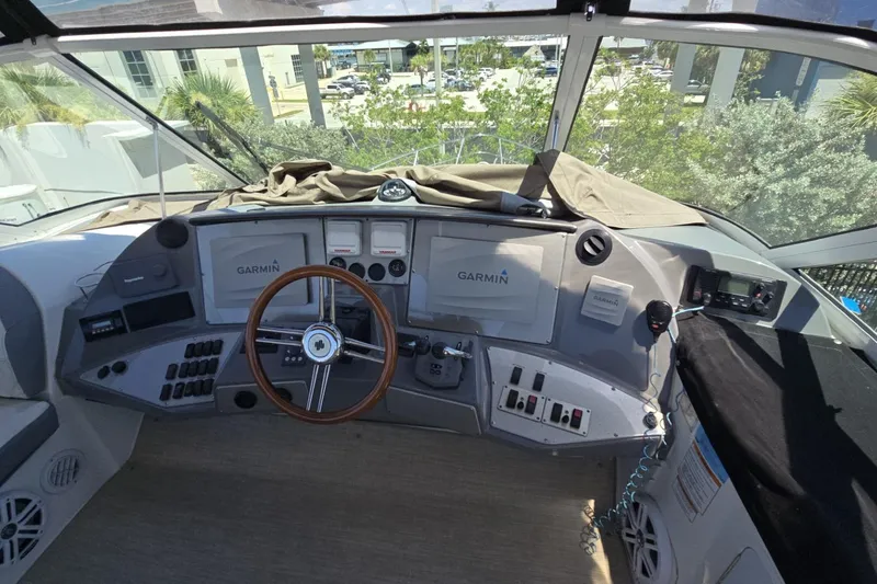 Slide: The Image of 2007 Cruisers Yachts 447 Sport Sedan helm with Garmin navigation system and steering wheel. - 14