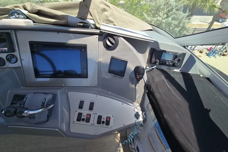 Slide: The Image of 2007 Cruisers Yachts 447 Sport Sedan helm with navigation and communication equipment. - 15