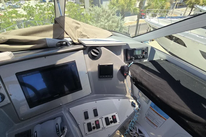 Slide: The Image of Interior helm of 2007 Cruisers Yachts 447 Sport Sedan with navigation equipment. - 17