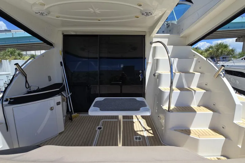 Slide: The Image of 2007 Cruisers Yachts 447 Sport Sedan interior with stairs and table, featuring sleek design. - 18