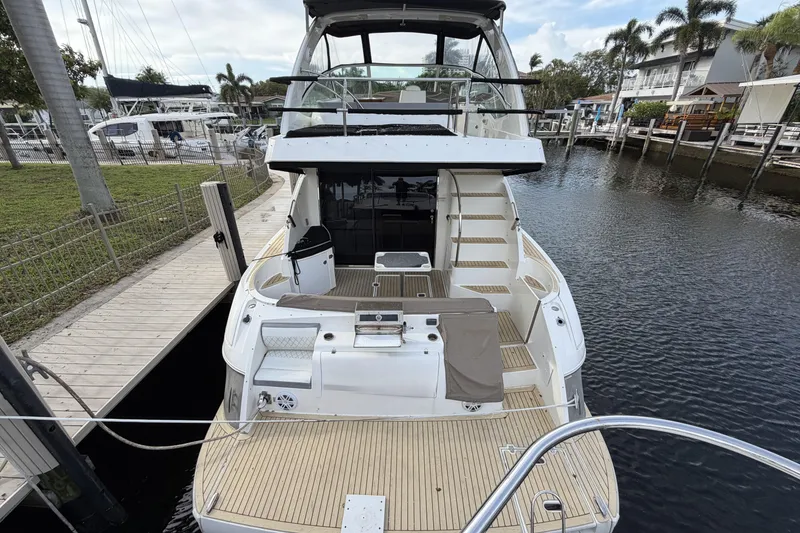 Slide: The Image of 2007 Cruisers Yachts 447 Sport Sedan docked at marina, rear view. - 2